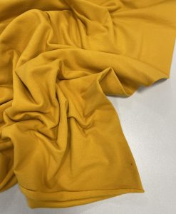 Pašiltintas, nestoras elastingas trikotažas Geltonas