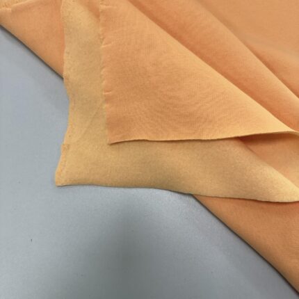 Pašiltintas, storas trikotažas Fuzz peach — trikotažas | Trys Pelėdos