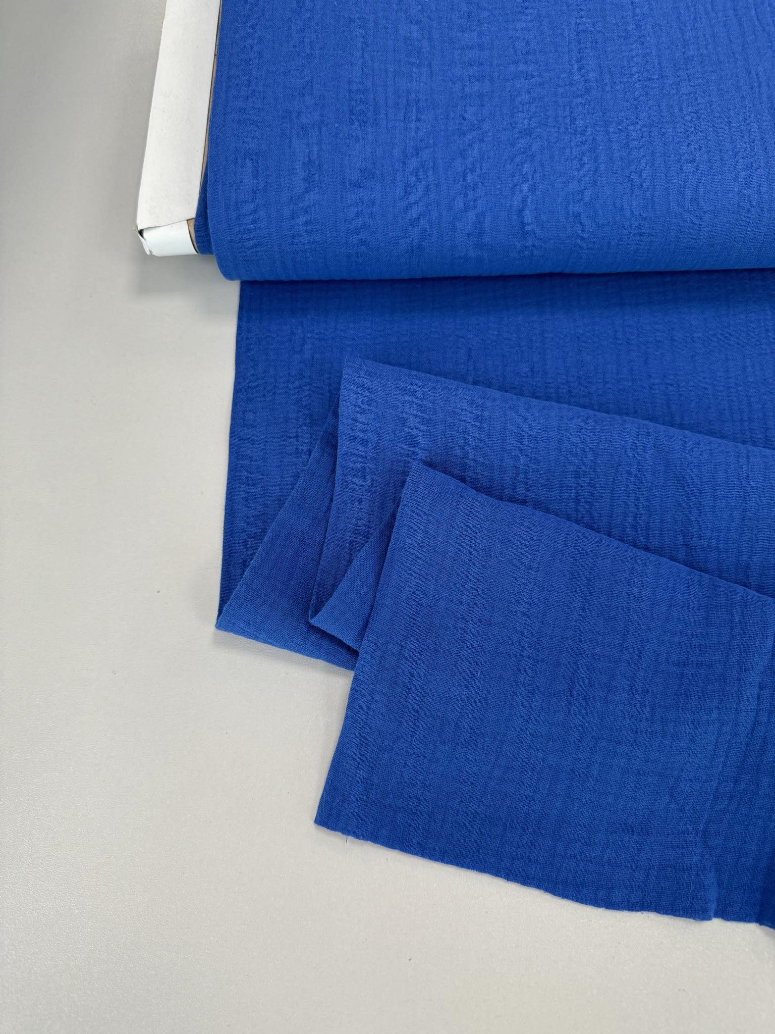 f01a9b4d-f786-4b80-98a3-aecefe167c79-rotated-1.jpg Medvilninis double gauze muslinas Karališkas mėlynas 28 — muslinas | Trys Pelėdos