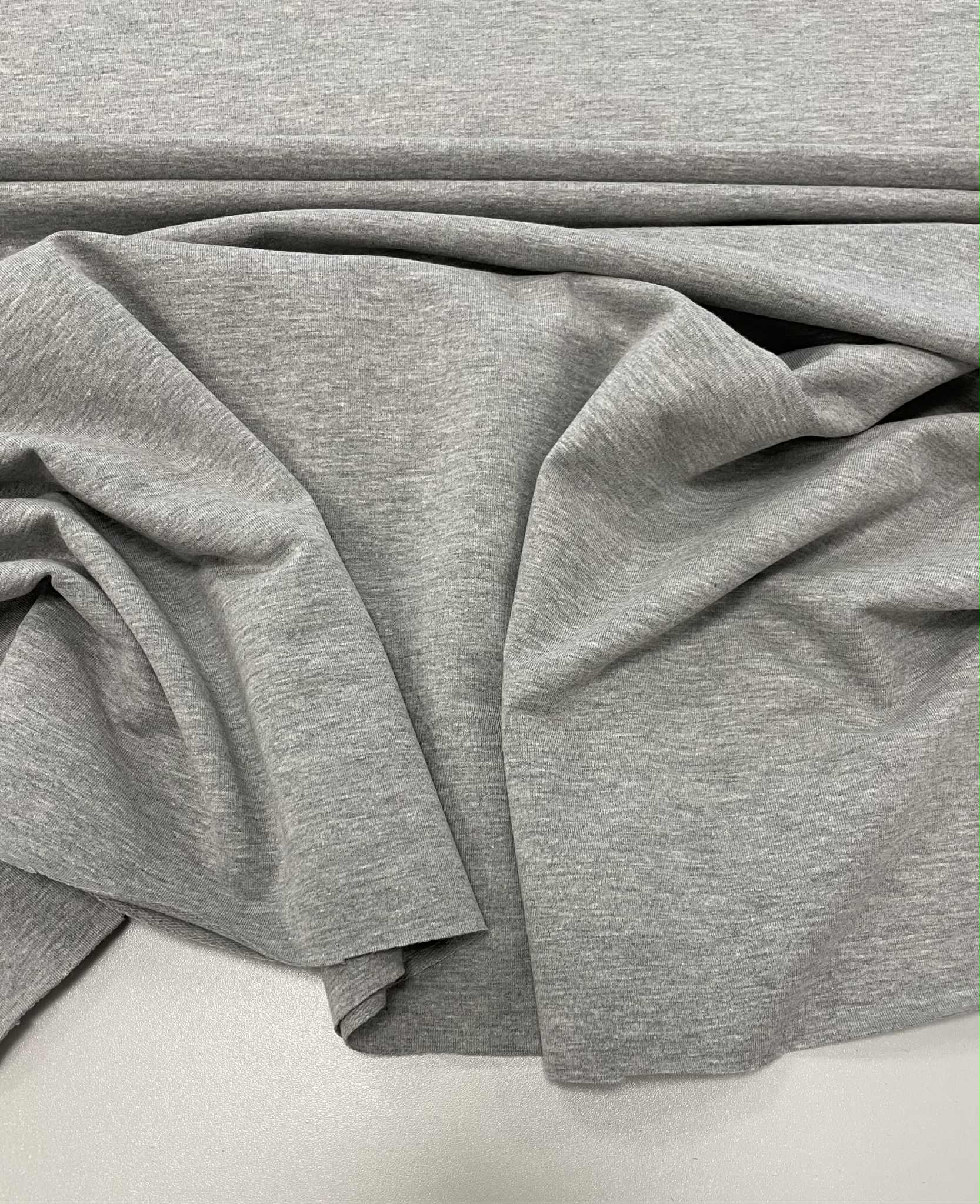 Kilpinis trikotažas Melange grey, 250 g/m2 Kilpinis trikotažas Melange grey, 250 g/m2 — trikotažas | Trys Pelėdos