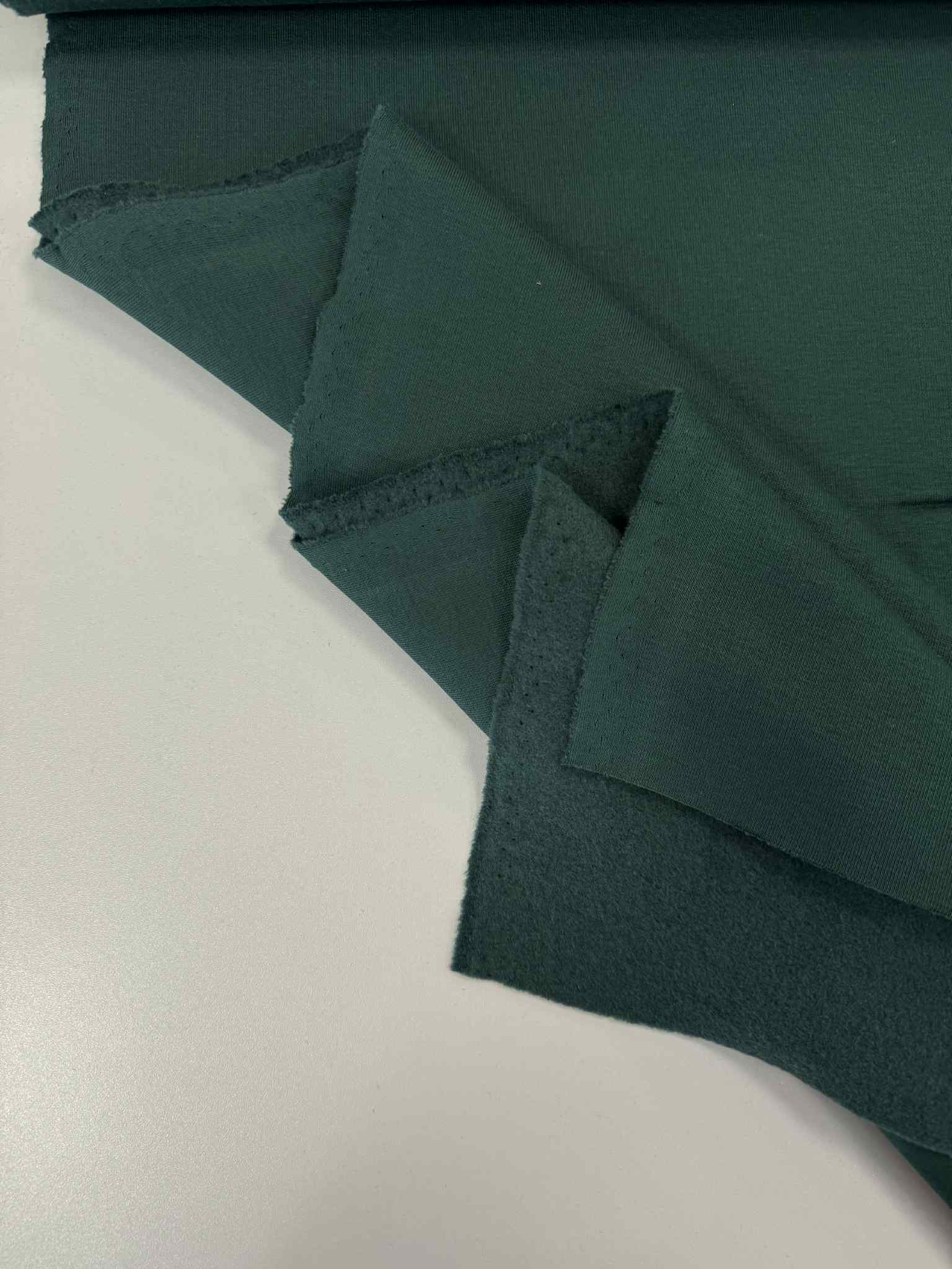 Pašiltintas, storas trikotažas Forest green Pašiltintas, storas trikotažas Forest green — trikotažas | Trys Pelėdos