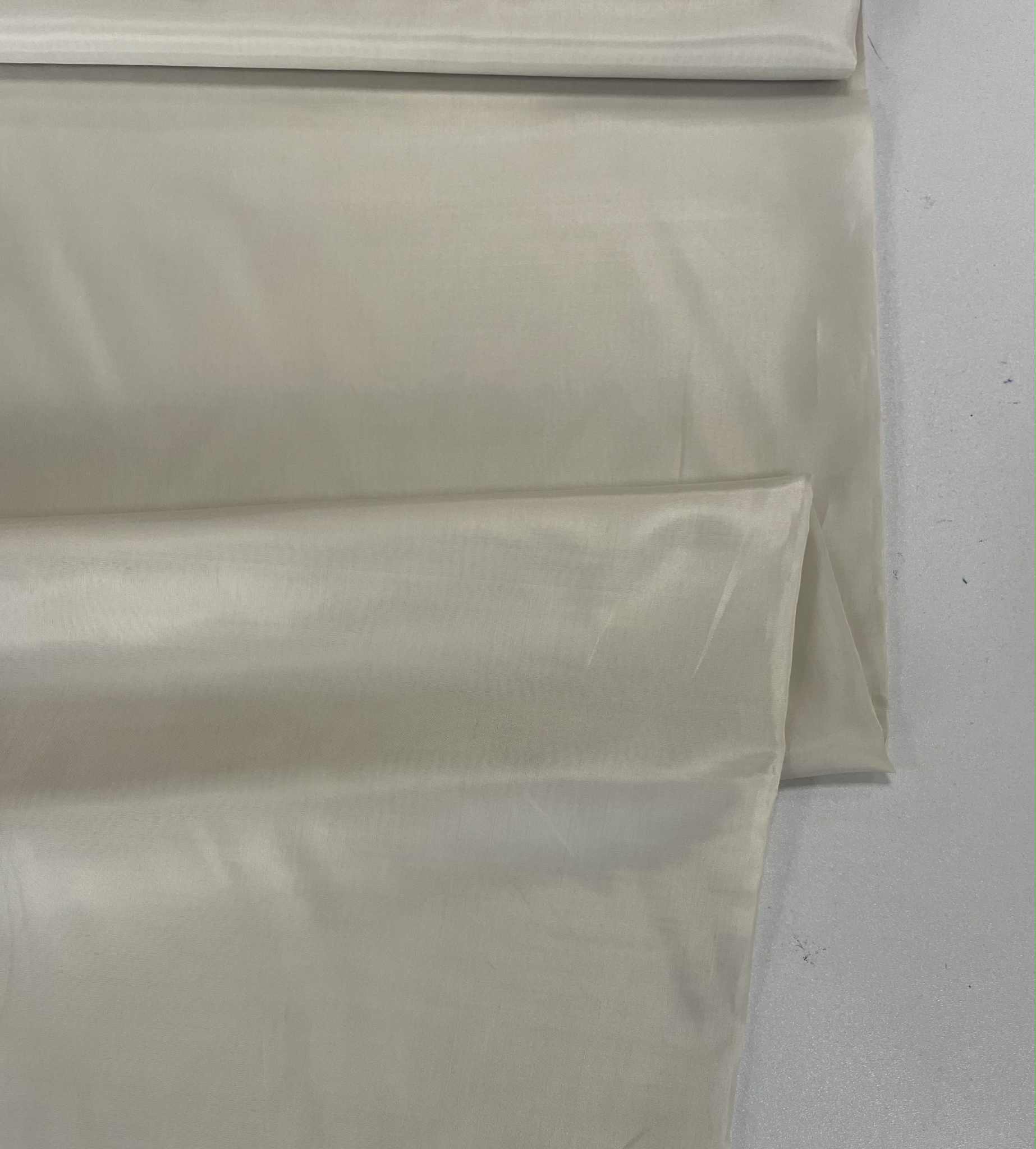 Pamušalinis audinys Smėlinė Pamušalinis audinys Smėlinė