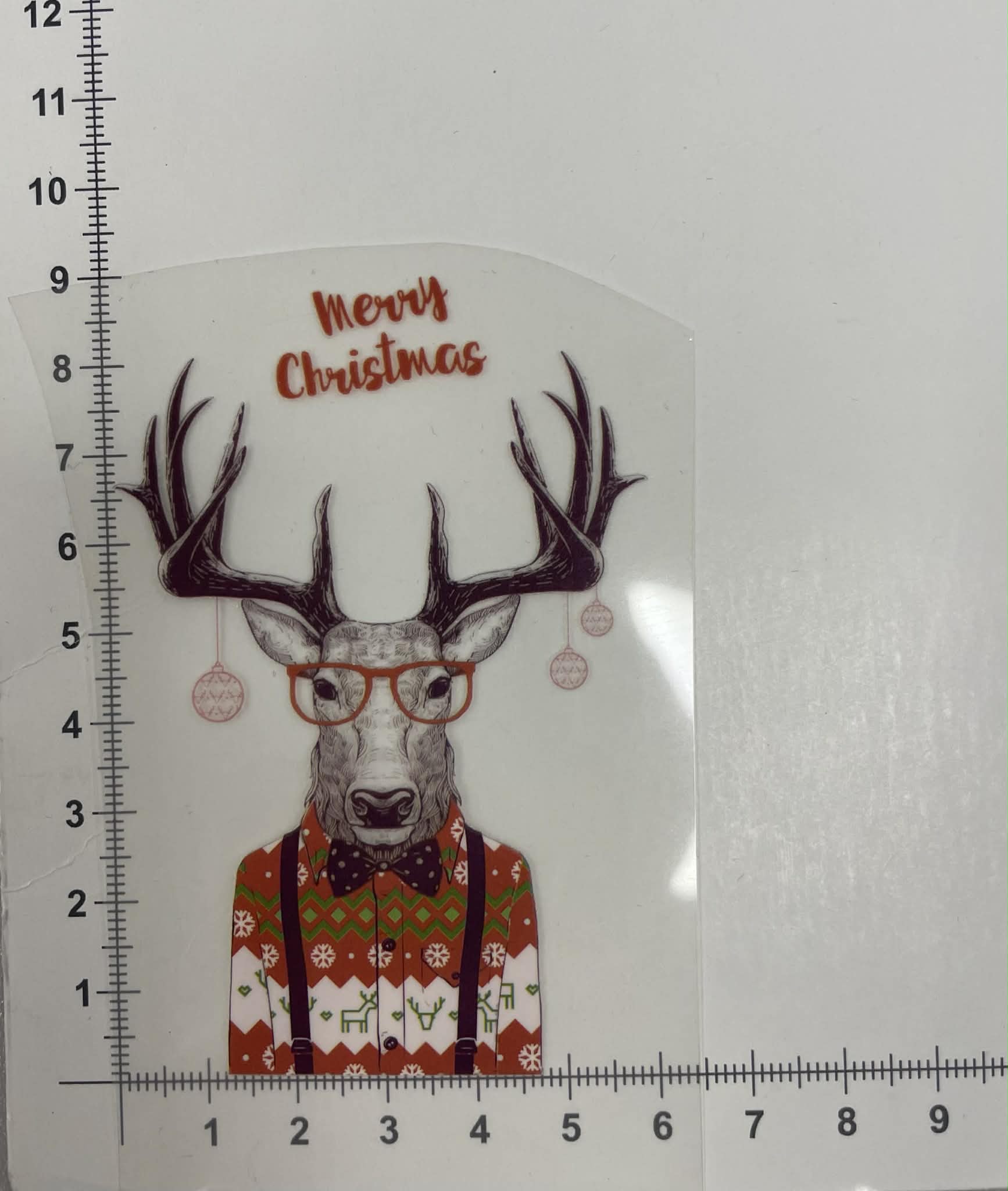 Termoaplikacija Kalėdinis Briedis su megztiniu Termoaplikacija Kalėdinis Briedis su megztiniu